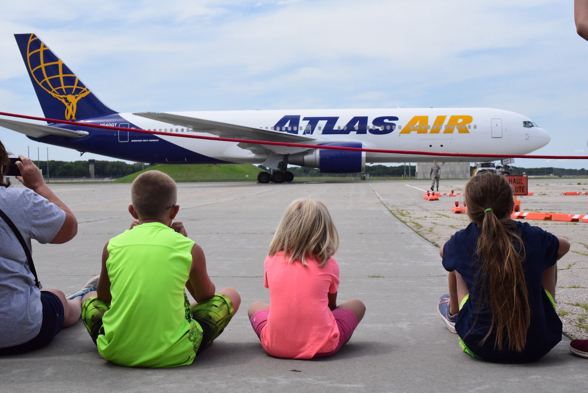 Children of deploying Airmen from the 115th Fighter Wing watch as the aircraft departs after a send off ceremony held at Truax Field, Madison, Wis. The 115th Fighter Wing deployed approximately 300 personnel and a number of aircraft to Afghanistan in support of Operation Freedom Sentinel and NATO's Resolute Support. (U.S. Air National Guard photo by Staff Sgt. Kyle Russell)