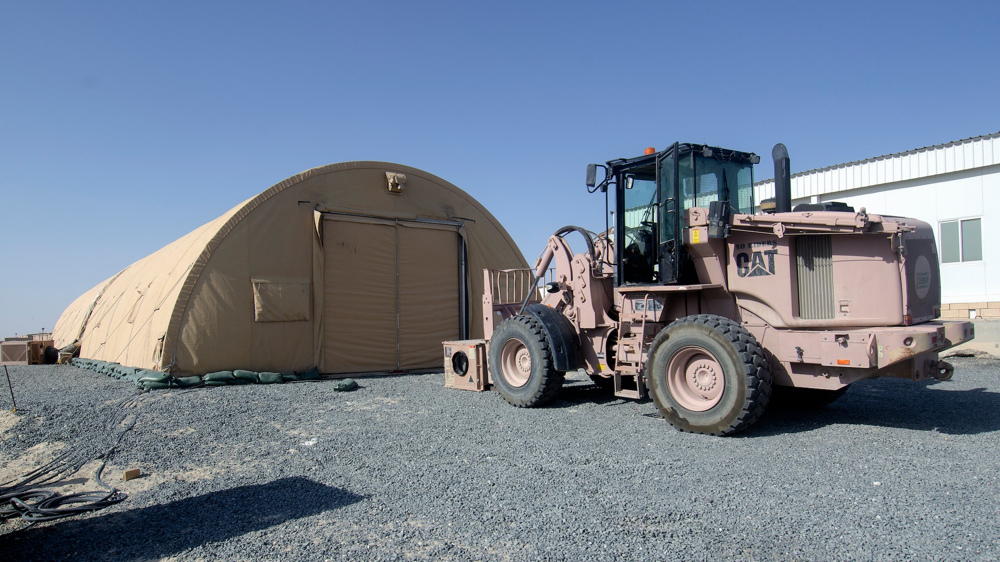 Airmen with the 386th Expeditionary Force Support Squadron and 386th Expeditionary Civil Engineer Squadron set up a new temporary fitness tent on Ali Al Salem Air Base, Kuwait, July 24, 2019. The new fitness tent is slated to open Aug.1, 2019, replacing the original facility which is scheduled for demolition to make room for future base improvement projects. This facility offers Airmen a second fitness location and expected to be in use until mid-November when the more permanent structure is completed. (U.S. Air Force photo by Capt. Stephen Hudson)