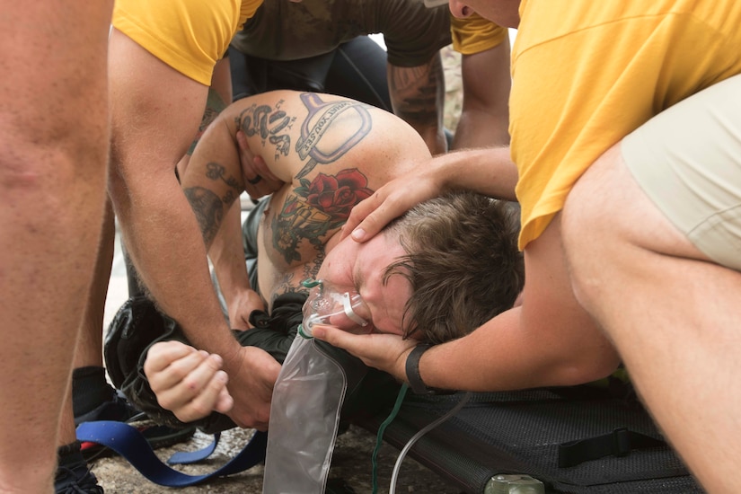 Army Pfc. Richard Ratliff, Army diver, 511th Engineer Dive Detachment, participates in the detachment’s annual training event ‘shallow brown’ as an injured Soldier at Kuwait Naval Base, Kuwait, July 19, 2019. The detachment is deployed to Kuwait in support of Operation Spartan Shield for U.S. Army Central. This training ensures the readiness of Soldiers within the ranks through equipment checks and qualifications.