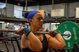 Sgt 1st Class Leilani Caracciolo, network manager noncommissioned officer in charge 1st Theater Sustainment Command (TSC), lifts a loaded barbell to an overhead position during her training for the 1,000-Pound Club at Otto Fitness Center at Fort Knox, Ky., July 17, 2019.