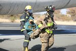 Firefighters with the Botswana Defense Force and the North Carolina National Guard work together to put out a fire and rescue victims from an airplane during a training exercise at Thebephatshwa Air Base in Botswana on July 17, 2019. The exercise was part of a two-day culminating event after more than 170 Army and Air Guard members.