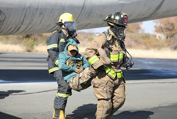 Firefighters with the Botswana Defense Force and the North Carolina National Guard work together to put out a fire and rescue victims from an airplane during a training exercise at Thebephatshwa Air Base in Botswana on July 17, 2019. The exercise was part of a two-day culminating event after more than 170 Army and Air Guard members.
