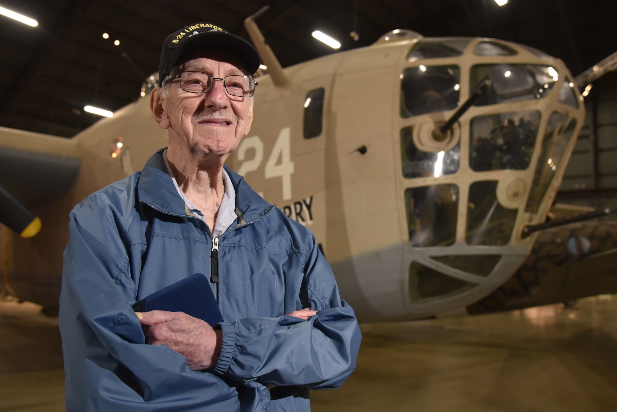 World War II veteran 1st Lt. Joseph Kollenberg poses in front of the B-24 “Strawberry Bitch” at the National Museum of the United States Air Force, July 24. Kollenberg served as a B-24 Navigator in the U.S. Army Air Corps from 1944-1945, completing more than 27 combat missions over Northern France, Germany, the Ardennes and Central Europe.  (Air Force photo/Ken LaRock)