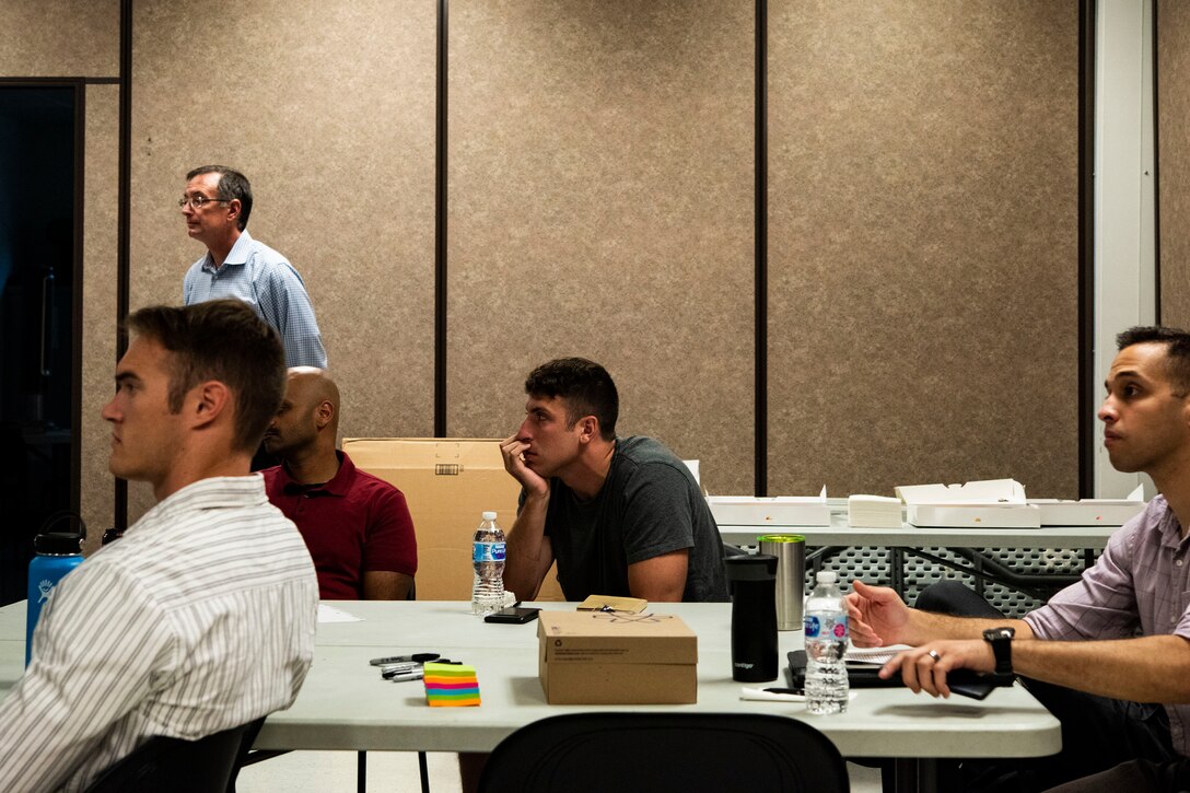 Participants listen to an instructor during a National Security Innovation Network “Innovation Bootcamp” course, July 23, 2019, at Moody Air Force Base, Ga. Over the four-day bootcamp, 29 Airmen learned how to apply innovative solutions to Moody specific challenges under guidance of a team from the University of California, Berkeley. (U.S. Air Force photo by Senior Airman Erick Requadt)