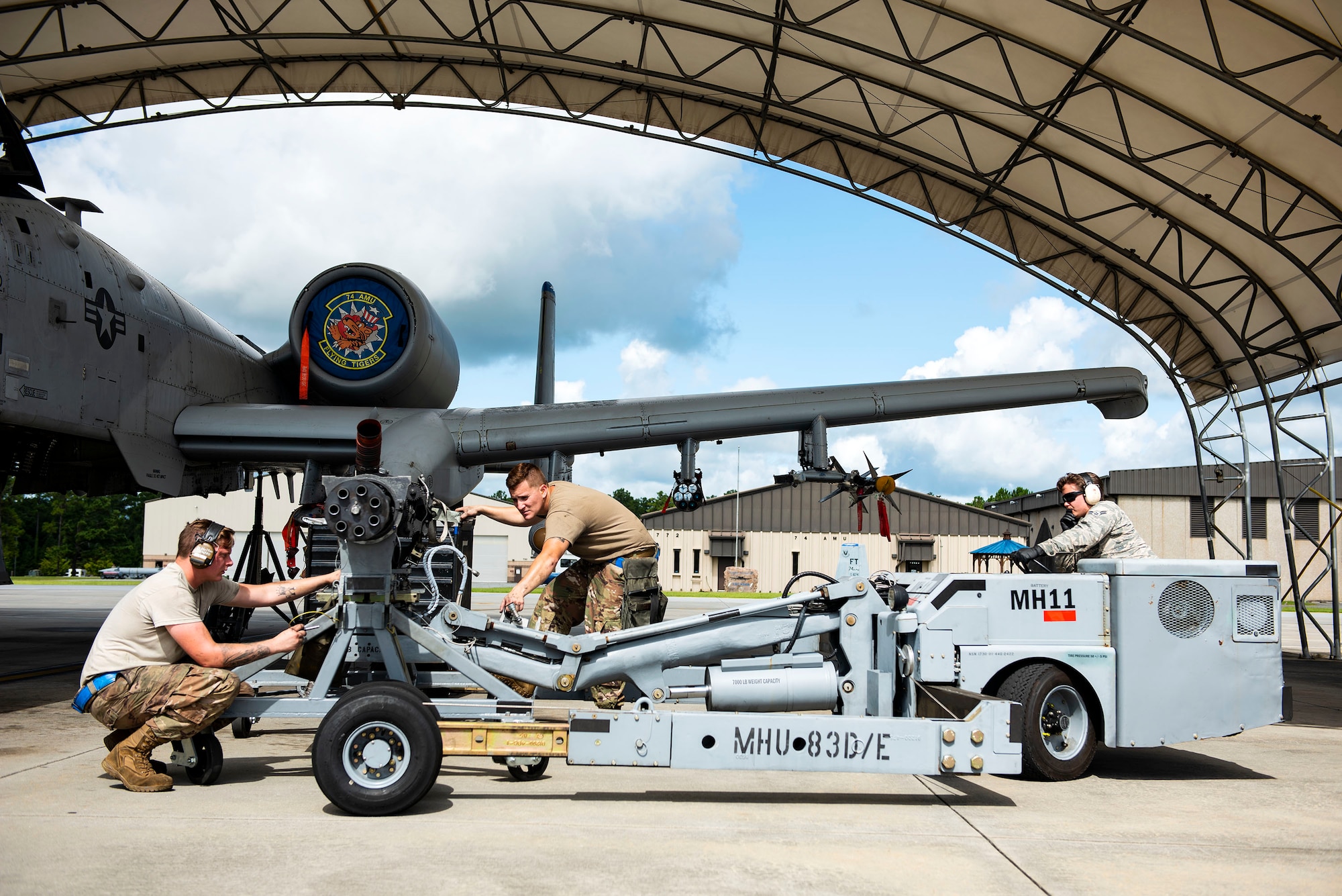 Airmen from the 74th Aircraft Maintenance Unit secure a 30mm GAU-8 Gatling Gun system during unscheduled maintenance, July 23, 2019, at Moody Air Force Base, Ga. Unscheduled maintenance occurs when discrepancies are discovered with A-10C Thunderbolt II weapon systems. These repairs aid in reducing down time of the aircraft and supporting sustained operations tempo. (U.S. Air Force photo by Senior Airman Erick Requadt)