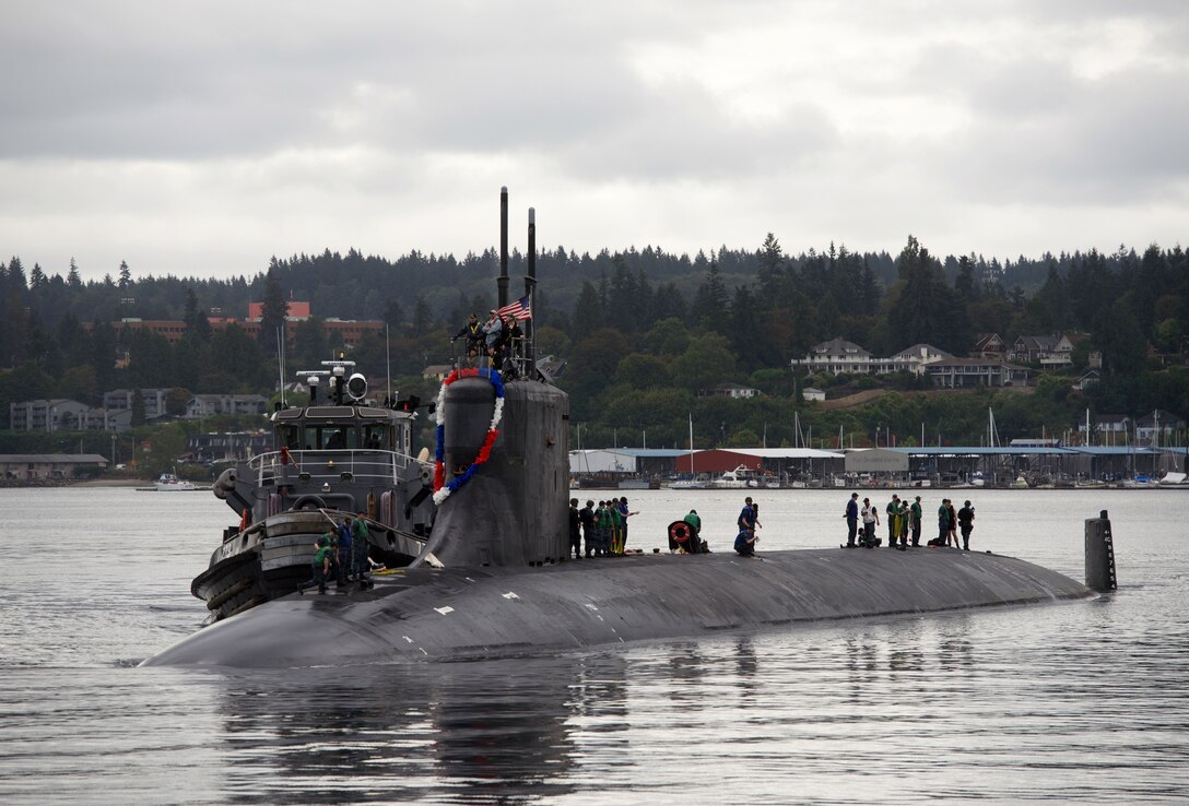 Sailors assigned to the fast-attack submarine USS Seawolf (SSN 21) return home to Naval Base Kitsap-Bremerton, following a six-month deployment. Seawolf is the first of the Navy’s three Seawolf-class submarines, designed to be faster and quieter than its Los Angeles-class counterpart.