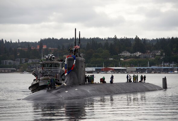Sailors assigned to the fast-attack submarine USS Seawolf (SSN 21) return home to Naval Base Kitsap-Bremerton, following a six-month deployment. Seawolf is the first of the Navy’s three Seawolf-class submarines, designed to be faster and quieter than its Los Angeles-class counterpart.
