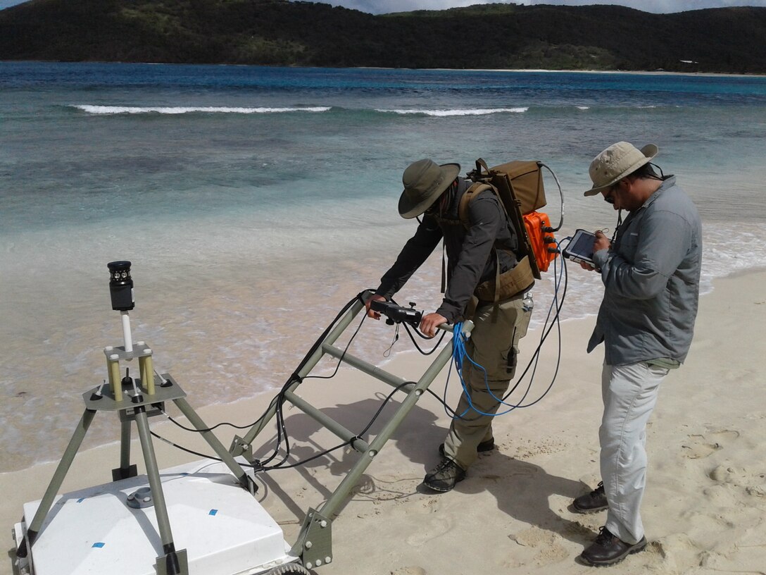 Workers use advanced geophysical classification to identify unexploded ordnances as part of the Time Critical Removal Action on Culebra Island in Puerto Rico. Advanced geophysical classification uses the natural properties of a buried metal to determine if the object is a target of interest. It will reduce the overall time and cost of remediation activities within the Formerly Used Defense Sites program.