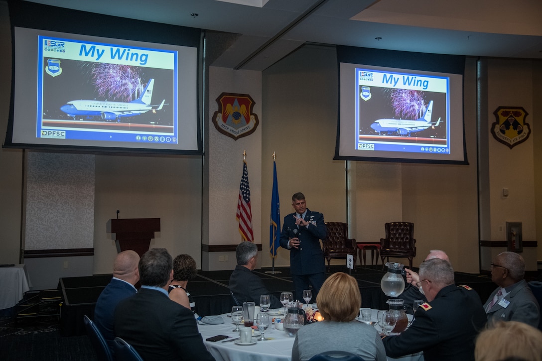 Col. Glenn Collins, commander, 932nd Airlift Wing shares information about the 932nd Airlift Wing mission and the Air Force Reserve Citizen Airmen that execute it daily with guests for the Employer Support of the Guard and Reserve award banquet, July 19, 2019, Scott Event Center, Scott Air Force Base, Illinois. (U.S. Air Force photo by Christopher Parr)