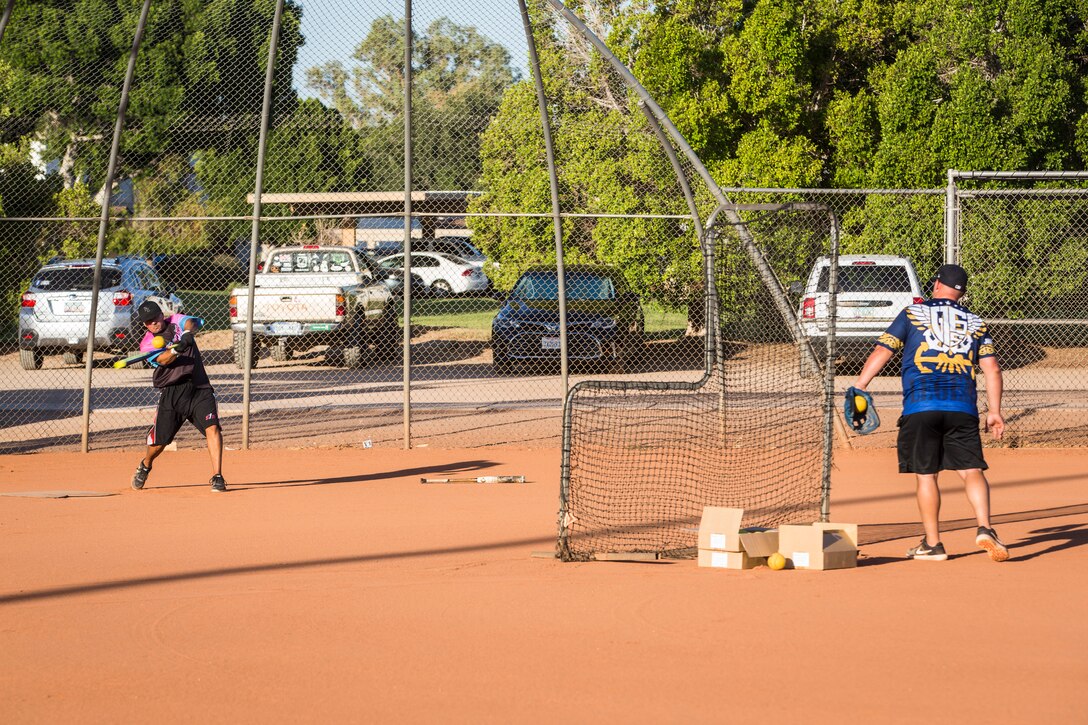 U.S. Marines, Sailors, and DoD employees participate in the Intramural Summer-Season Softball Home-Run Derby on Marine Corps Air Station Yuma, Ariz., July 1, 2019. The derby was hosted by Marine Corps Community Services (MCCS) as a friendly competition between the intramural softball teams to kick off their playoff season. (U.S. Marine Corps photo by Sgt. Isaac D. Martinez)