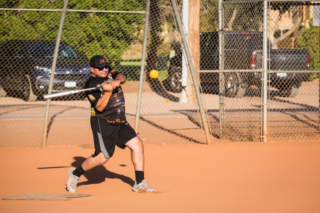 U.S. Marines, Sailors, and DoD employees participate in the Intramural Summer-Season Softball Home-Run Derby on Marine Corps Air Station Yuma, Ariz., July 1, 2019. The derby was hosted by Marine Corps Community Services (MCCS) as a friendly competition between the intramural softball teams to kick off their playoff season. (U.S. Marine Corps photo by Sgt. Isaac D. Martinez)