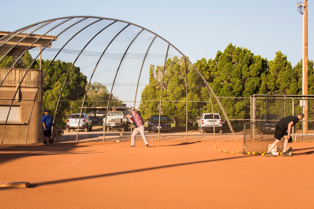 U.S. Marines, Sailors, and DoD employees participate in the Intramural Summer-Season Softball Home-Run Derby on Marine Corps Air Station Yuma, Ariz., July 1, 2019. The derby was hosted by Marine Corps Community Services (MCCS) as a friendly competition between the intramural softball teams to kick off their playoff season. (U.S. Marine Corps photo by Sgt. Isaac D. Martinez)
