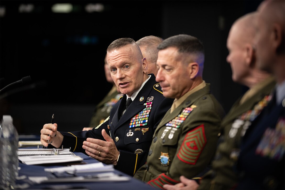 Sergeant major speaks to reporters alongside other senior enlisted leaders.