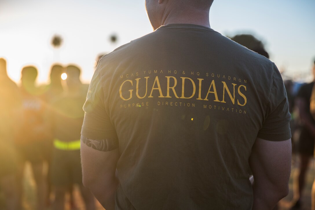 U.S. Marines with Headquarters and Headquarters Squadron (H&HS) participate in an Independence Day Motivational Run at Marine Corps Air Station Yuma, Ariz., July 3, 2019. After the run, Marines throughout the squadron were awarded and recognized for various accomplishments. (U.S. Marine Corps photo by Cpl. Sabrina Candiaflores)