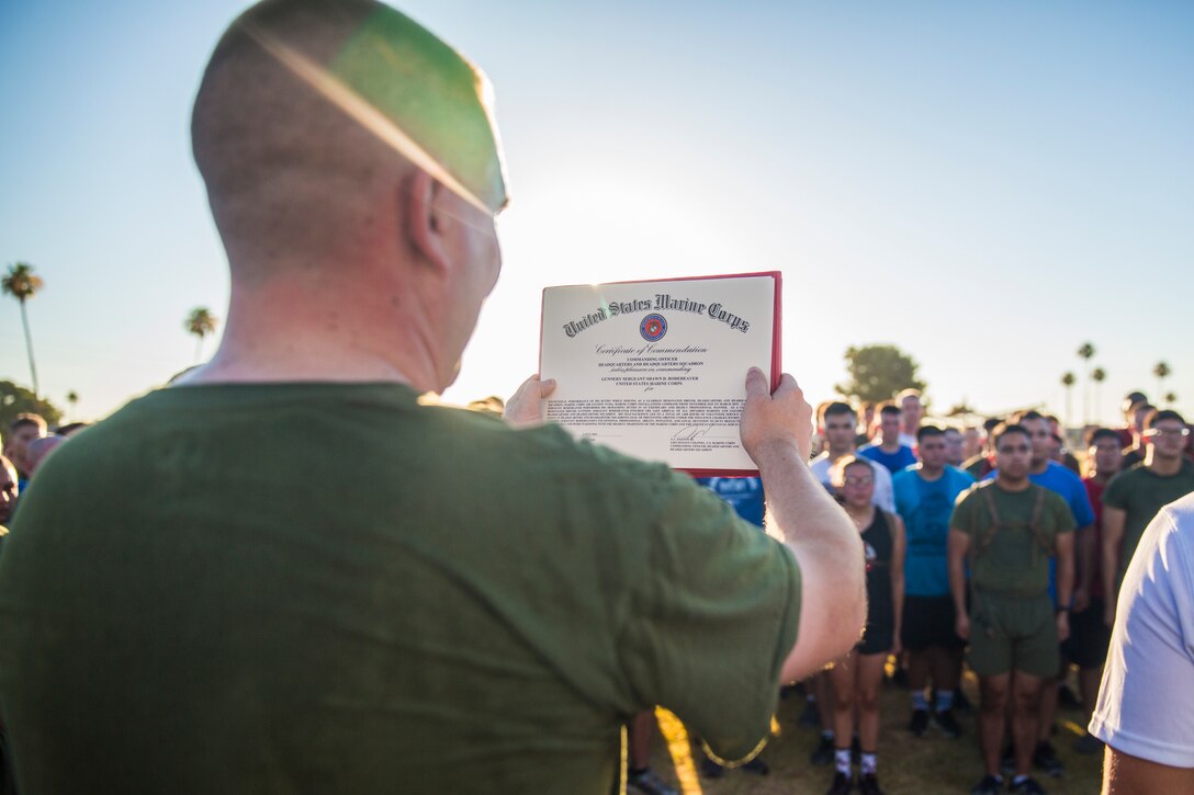 U.S. Marines with Headquarters and Headquarters Squadron (H&HS) participate in an Independence Day Motivational Run at Marine Corps Air Station Yuma, Ariz., July 3, 2019. After the run, Marines throughout the squadron were awarded and recognized for various accomplishments. (U.S. Marine Corps photo by Cpl. Sabrina Candiaflores)