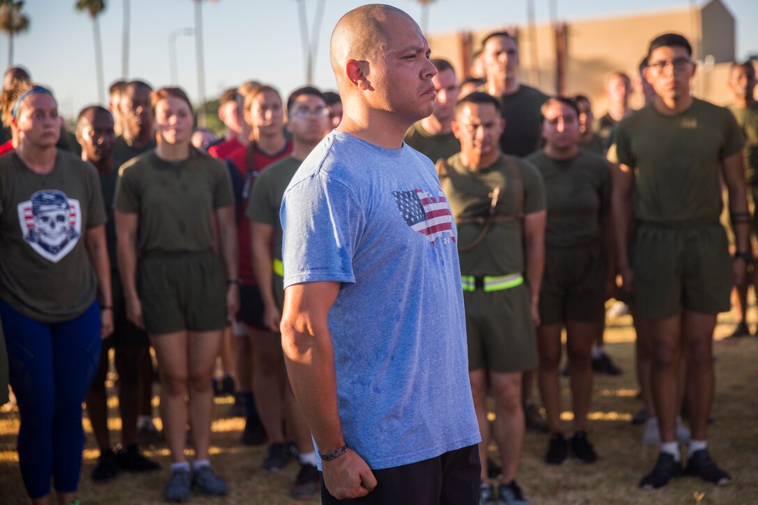 U.S. Marines with Headquarters and Headquarters Squadron (H&HS) participate in an Independence Day Motivational Run at Marine Corps Air Station Yuma, Ariz., July 3, 2019. After the run, Marines throughout the squadron were awarded and recognized for various accomplishments. (U.S. Marine Corps photo by Cpl. Sabrina Candiaflores)