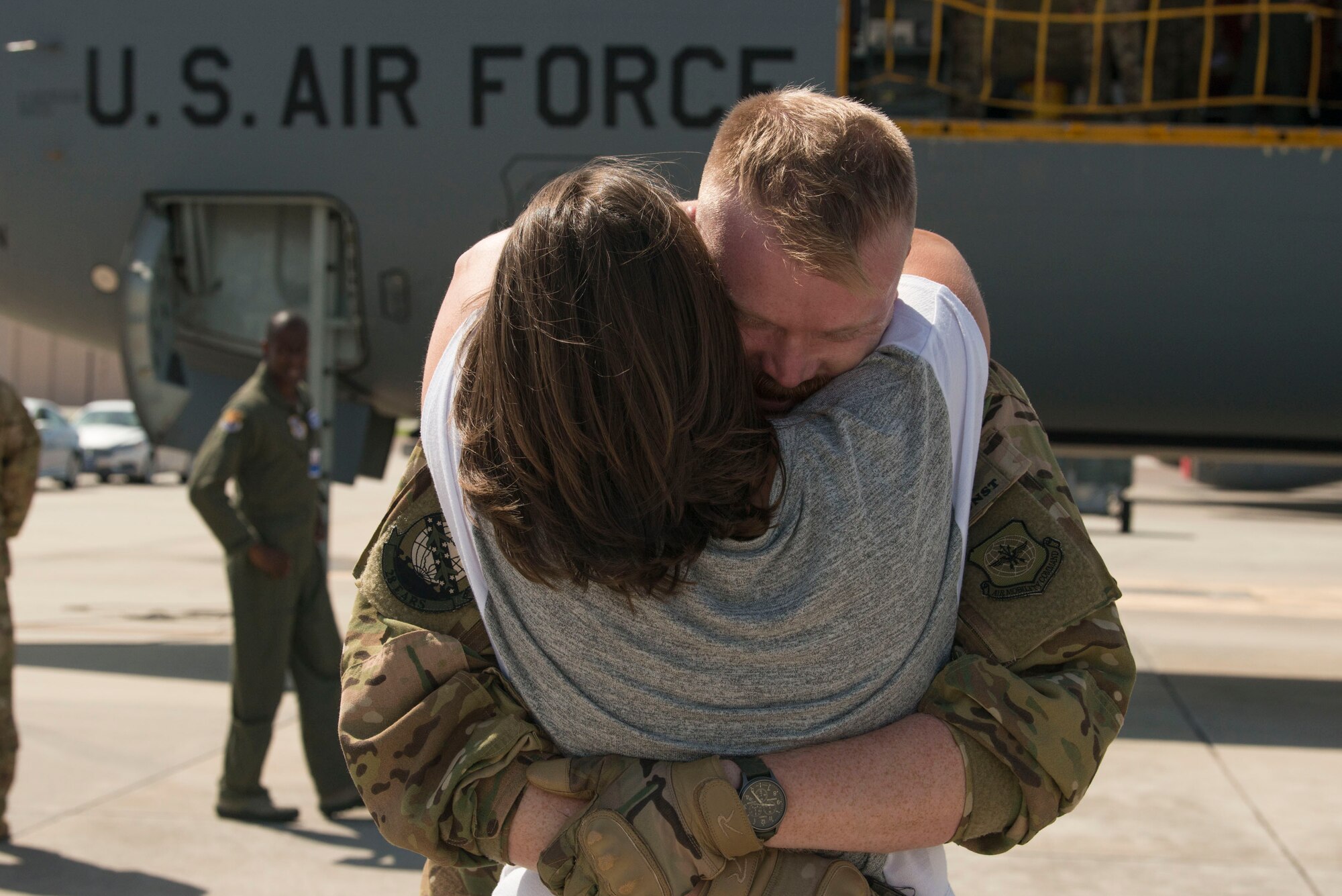 U.S. Air Force Staff Sgt. Jeffrey Sieff, a Boom Operator with the 50th Air Refueling Squadron, embraces his wife Ivy, after returning from a deployment, MacDill Air Force Base, Fla., June 22, 2019.