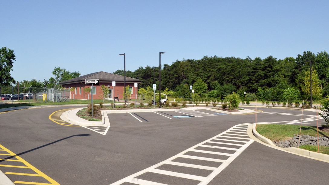 New McNamara Headquarters Complex Visitors Control Center building and parking lot.
