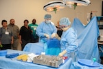 Seaman Emille Sichz and Seaman Apprentice Ciaran Braswell, students in the Surgical Technician program at the Medical Education and Training Campus at Joint Base San Antonio-Fort Sam Houston perform a mock surgery during a tour. The tour provided San Antonio educators and counselors with a general overview of the Navy in an effort to raise awareness of Navy career opportunities through a tour of the medical training campus.