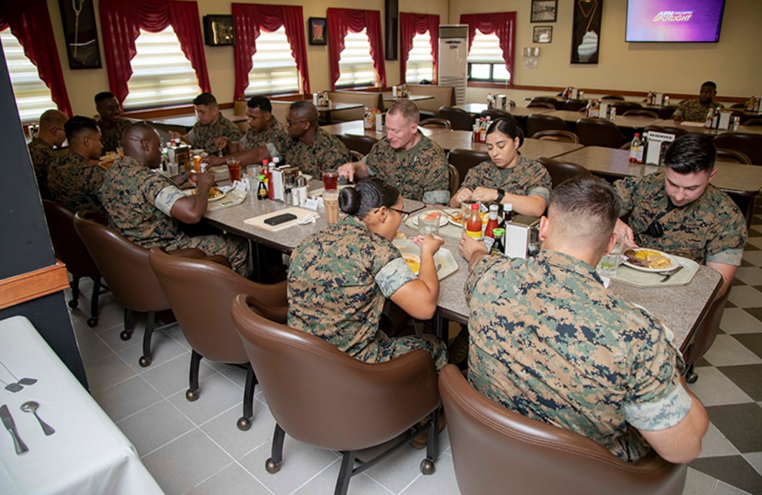 Maj. Edward Banta, commander, Marine Corps Installations Command, shares lunch with Marines assigned to various units within Camp Mujuk in South Korea, July 22, 2019. Banta was visiting Marine Corps Installations throughout the pacific in order to see how day-to-day operations are conducted. (U.S. Marine Corps photo by Lance Cpl. Savannah Mesimer)