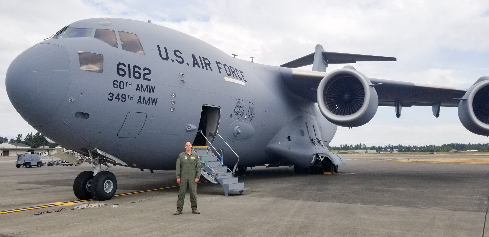 Maj. Dennis Martin, 225th Air Defense Squadron air battle manager, prepares to board a C-17 asssigned to the 60th Air Moblity Wing from Travis Air Force Base, Calif., as part of Exercise Rainier War June 26, 2019 at Joint Base Lewis-McChord.  Martin is one of four air battle managers flying onboard the C-17s during the exercise in order to accomplish a portion of his training requirements to convert to a rated air battle manager.  (Courtesy Photo)