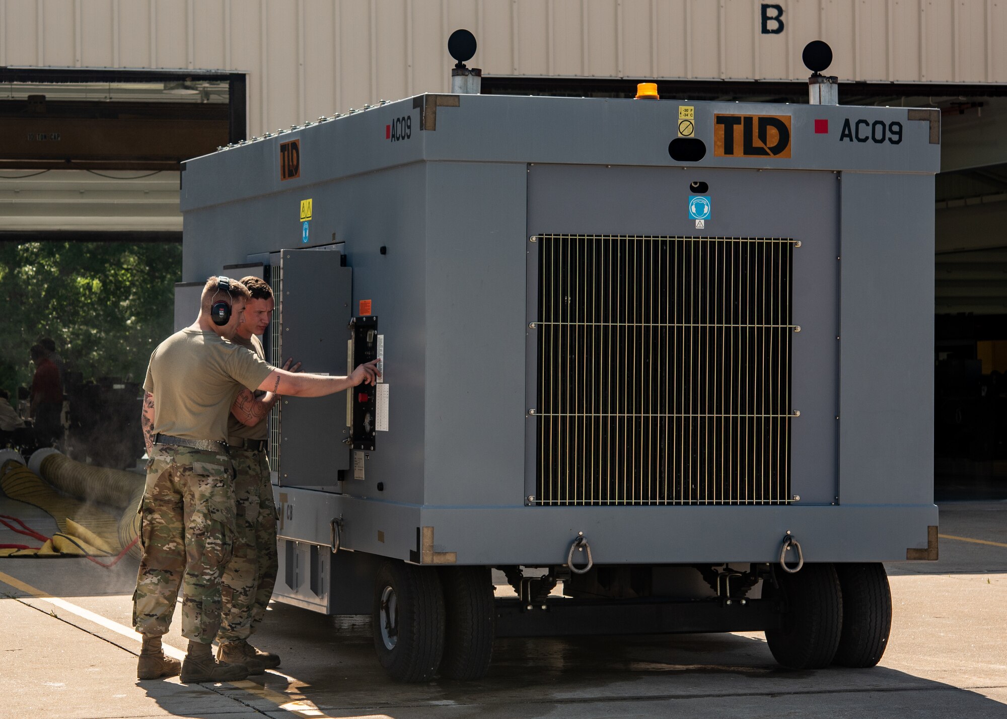 Airmen 1st Class Logan Peters and Devin Julia, aerospace ground equipment apprentices, assigned to the 509th Maintenance Squadron, test a potential B-2 HVAC system for the B-2 Spirit Stealth Bomber on July 18, 2019, at Whiteman Air Force Base, Missouri. The data collected will be compiled and summarized by the University of Dayton Research Institute and Air Force Research Laboratory in order to make a final decision on an HVAC system for the B-2. (U.S. Air Force photo by Senior Airman Thomas Barley)