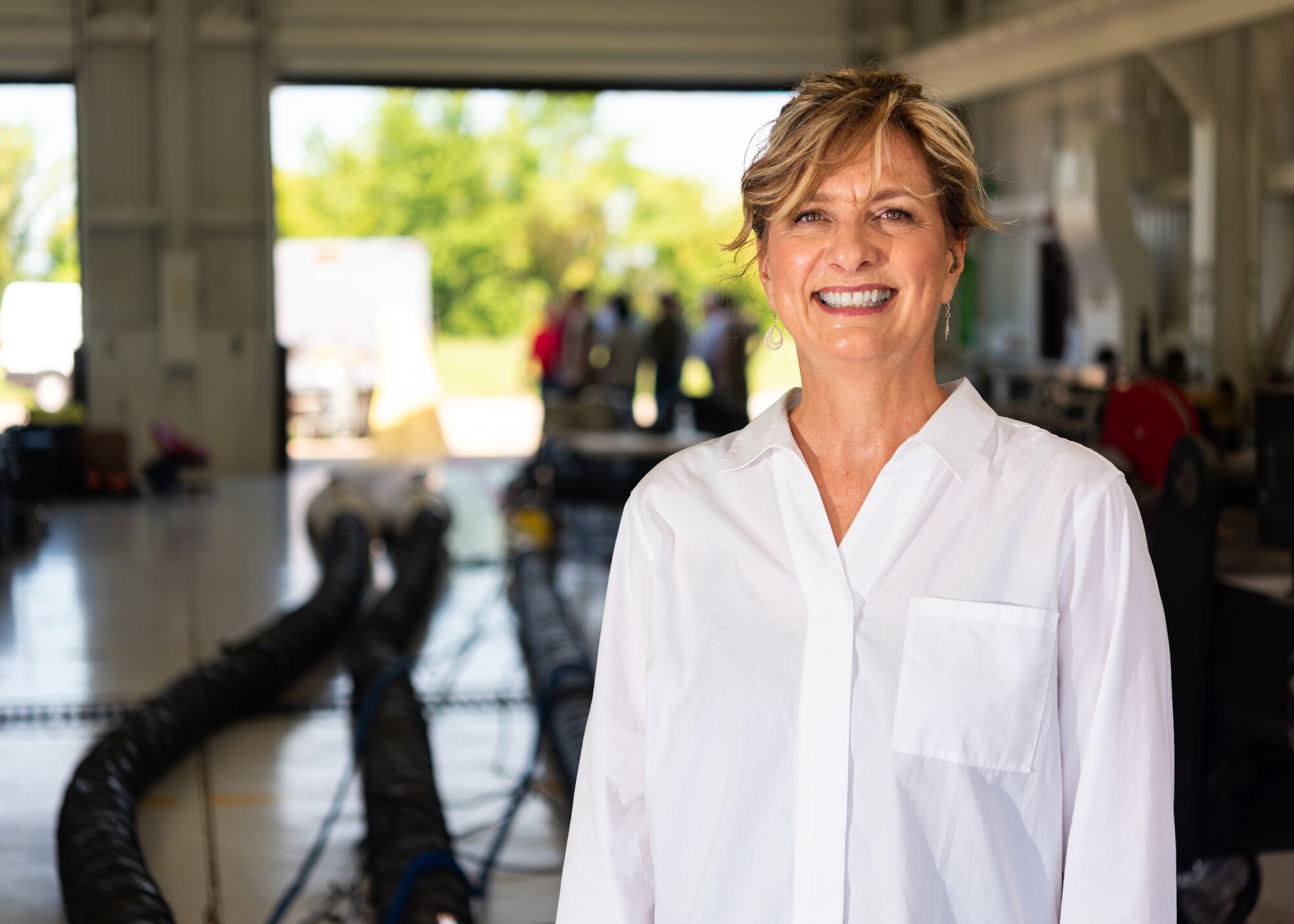 Barbara Douglas, logistics specialist, assigned to the Air Force Life Cycle Management Center, B-2 Spirit office, poses for a photo on July 18, 2019, at Whiteman Air Force Base, Missouri. Douglas leads the heating, ventilation, and air conditioning program in charge of finding a replacement HVAC system for the B-2 Spirit Stealth Bomber.  (U.S. Air Force photo by Senior Airman Thomas Barley)