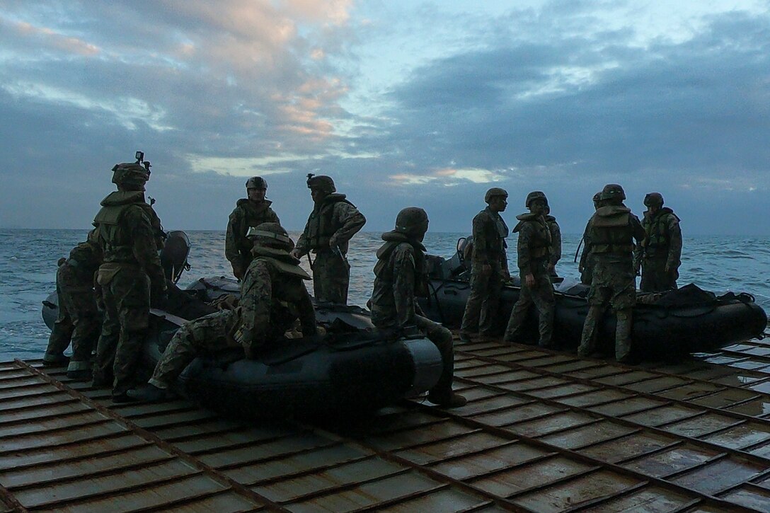 Marines with Battalion Landing Team, 2nd Battalion, 1st Marines, 31st Marine Expeditionary Unit, prepare to launch Combat Rubber Raiding Craft during a boat raid exercise aboard the amphibious dock landing ship USS Ashland, underway in the Coral Sea, July 3, 2019. Ashland, part of the Wasp Amphibious Ready Group, with embarked 31st MEU, is operating in the Indo-Pacific region to enhance interoperability with partners and serve as a ready-response force for any type of contingency, while simultaneously providing a flexible and lethal crisis response force ready to perform a wide range of military operations.