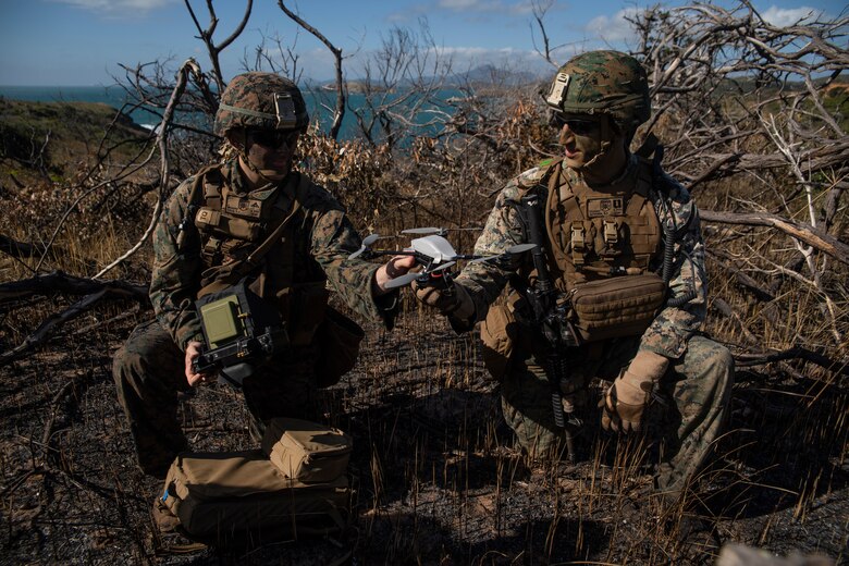 Lance Cpl. Kaleb J. Kolb (left), an intelligence Marine, and Capt. Benjamin F. Sutphen (right), Golf Company Commander, both with Battalion Landing Team, 2nd Battalion, 1st Marines, 31st Marine Expeditionary Unit, prepare to launch an Instanteye MK-2 GEN3-A0 drone during a boat raid exercise on Townshend Island, Shoalwater Bay Training Area, Queensland, Australia, July 3, 2019. The 31st Marine Expeditionary Unit, the Marine Corps' only continuously forward-deployed MEU, provides a flexible and lethal force ready to perform a wide range of military operations as the premier crisis response force in the Indo-Pacific region.