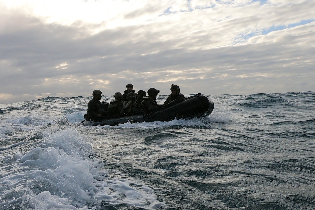 Marines with Battalion Landing Team, 2nd Battalion, 1st Marines, 31st Marine Expeditionary Unit, ride ashore in a Combat Rubber Raiding Craft during a boat raid exercise in the Coral Sea, July 3, 2019. The Marines launched from the amphibious dock landing ship USS Ashland, part of the Wasp Amphibious Ready Group, with embarked 31st MEU, while operating in the Indo-Pacific region to enhance interoperability with partners and serve as a ready-response force for any type of contingency, while simultaneously providing a flexible and lethal crisis response force ready to perform a wide range of military operations.