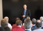 Naval Surface Warfare Center (NSWC) Crane Division Technical Director (TD) Dr. Brett Seidle (SES) shares experiences during a lessons in leadership presentation at NSWC Panama City Division (PCD) July 25. Seidle switched places recently with NSWC PCD TD Ed Stewart (SES) in a new approach to leadership and innovation with collaboration.