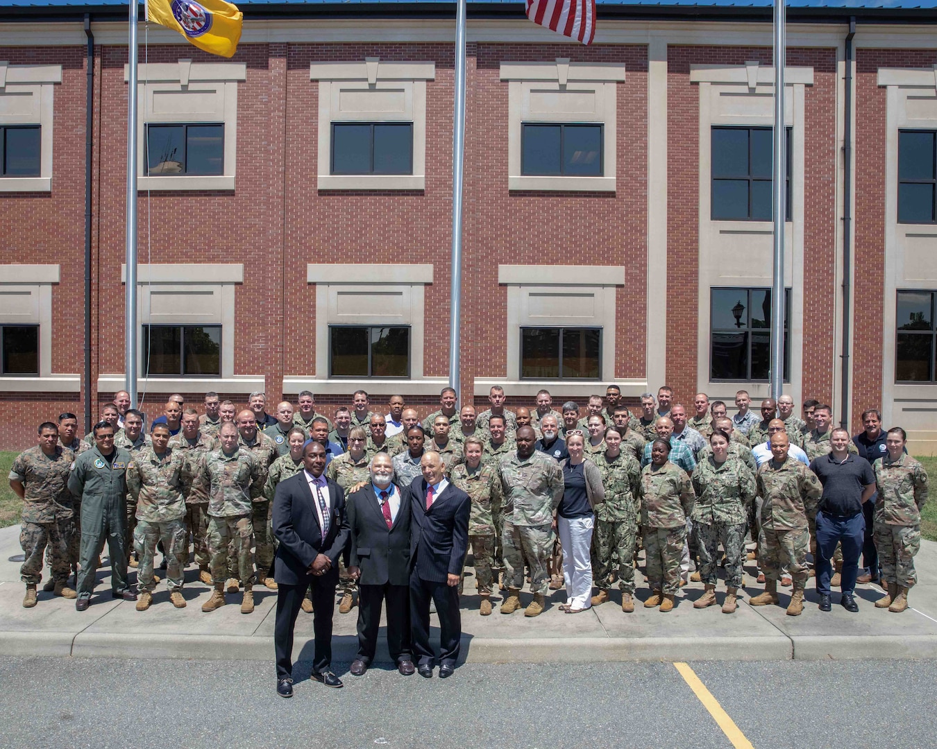 Students from the Department of Defense (DoD) Defense Support of Civil Support Authorities (DSCA) II course gather for a group photo outside of the Joint Task Force Civil Support (JTF-CS) headquarters. The course was held July 16-19 and educated 62 members of the United States military and other federal agencies in planning, coordinating, executing and supporting DSCA operations.  The course is administered in three distinct phases: Phase I is an 8-hour distance learning preparatory course, Phase II is a 3.5 day resident course, and Phase III is continuing education through alumni updates. (Official DoD photo by Mass Communication Specialist 3rd Class Michael Redd/released)