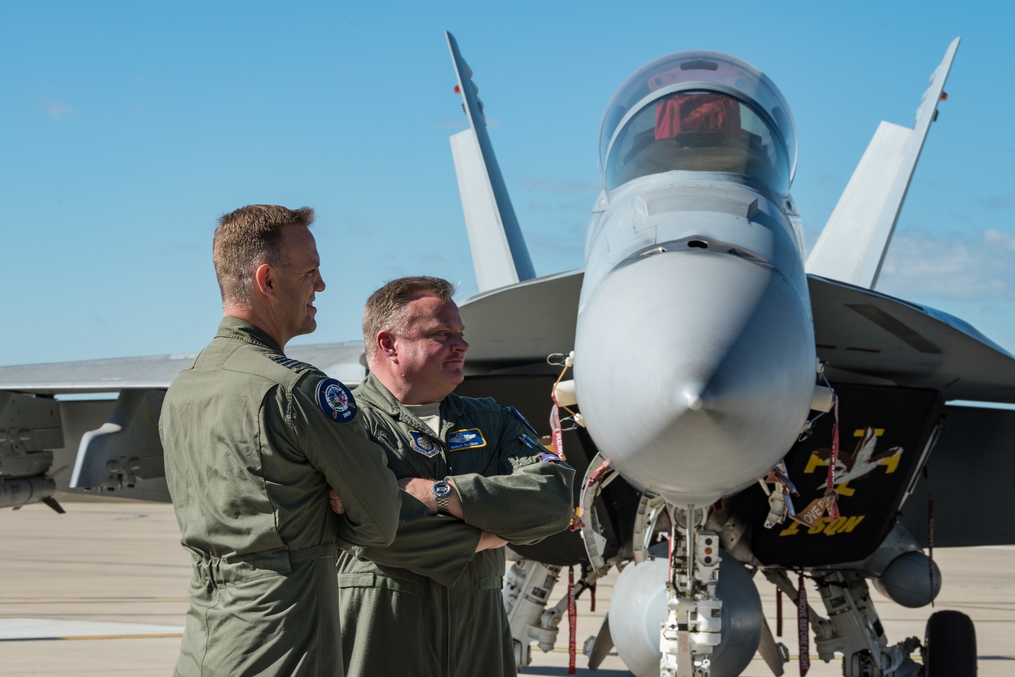 U.S. Air Force Col. Brian “Barley” Baldwin, 13th Air Expeditionary Force group commander and  Group Capt. Stephen Chappell, Task Unit Headquarters commander for Talisman Sabre 19 speak to Australian media on the Royal Australian Air Force Base Amberley flightline, July 10, 2019.