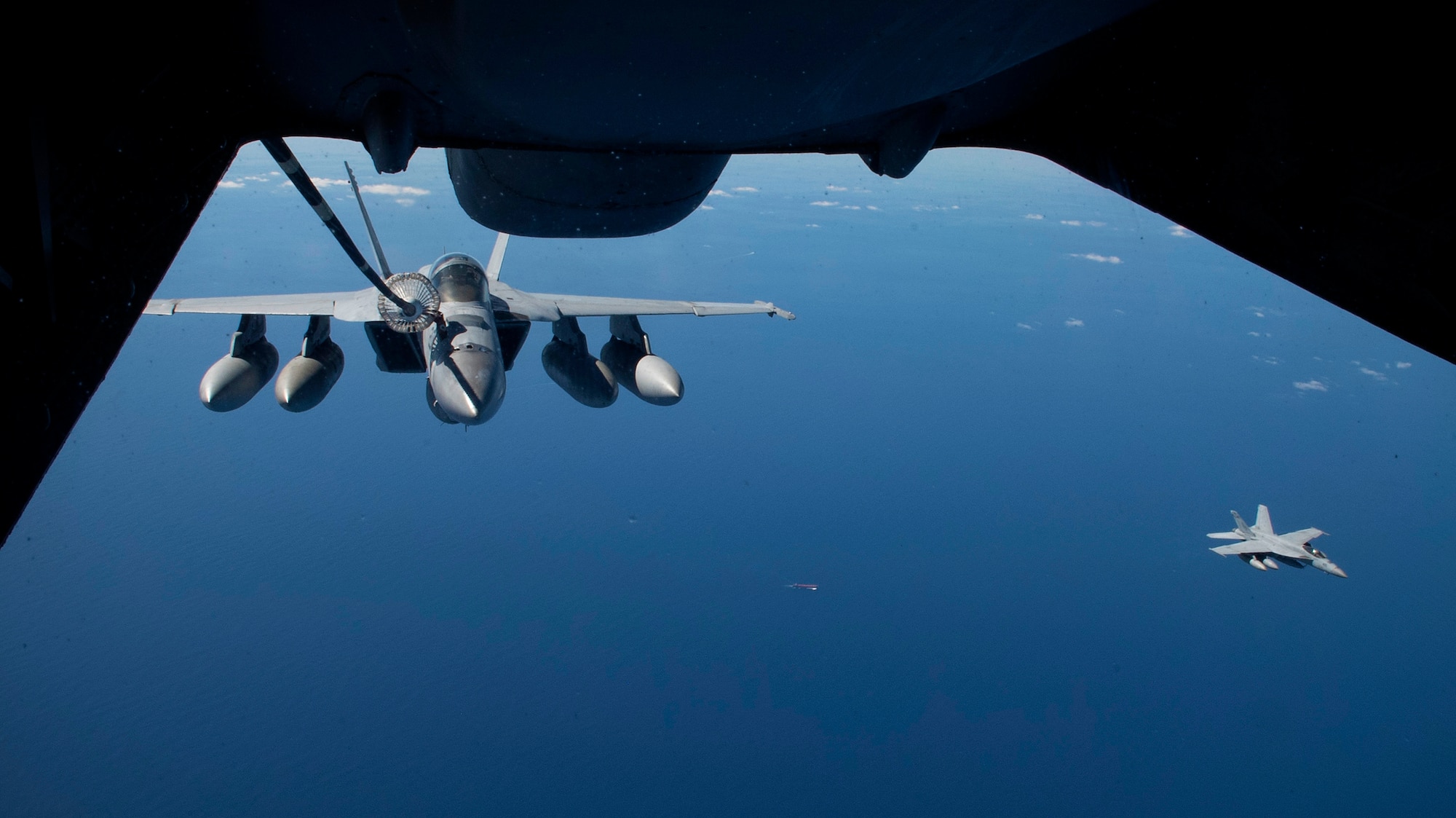 A U.S. Navy F/A-18 Super Hornet is refueled by a U.S. Air Force KC-10 Extender July 17, 2019 over the Pacific Ocean near the coast of Brisbane, Australia, in support of Exercise Talisman Sabre 19.