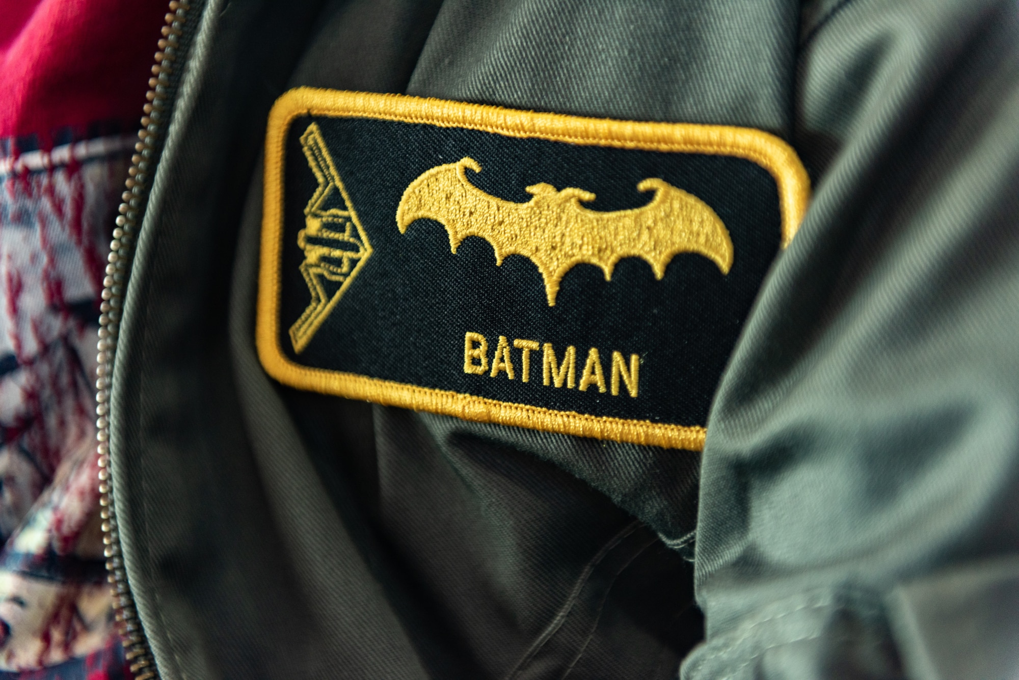 A patch is stitched with the name and call sign of Emil “Batman” Conley from Lee Summit, Missouri during the Pilot for a Day tour, on July 19, 2019, at Whiteman Air Force Base, Missouri. Emil received his call sign “Batman” from the 393rd Bomb Squadron commander during a pool party that kicked off their tour. Emil has medulloblastoma, which is the most common malignant brain tumor for children, and accounts for about 20 percent of all childhood brain tumors. Whiteman AFB collaborates with St. Jude Children’s Research Hospital to coordinate these tours. (U.S. Air Force photo by Senior Airman Thomas Barley)