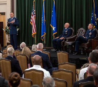 Maj. Gen. Brad Spacy (left), outgoing Air Force Installation and Mission Support Center commander, addresses the audience during the AFIMSC change of command July 25 at Joint Base San Antonio-Lackland. The general is retiring after 32 years of service.