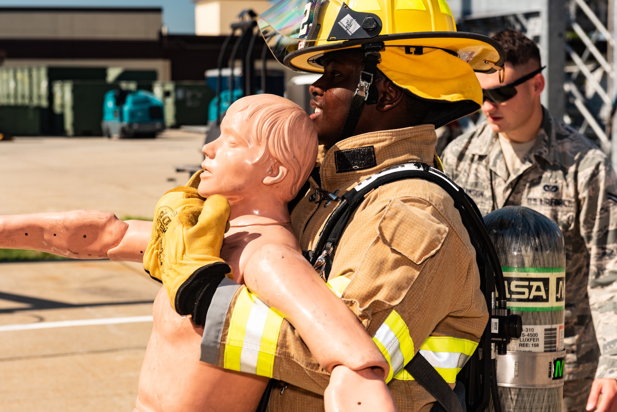 Eli Conley from Lee Summit, carries a fire-fighting rescue mannequin during a Pilot for a Day tour on July 19, 2019, at Whiteman Air Force Base, Missouri. Emil has medulloblastoma, which is the most common malignant brain tumor of childhood, and it accounts for about 20 percent of all childhood brain tumors. Medulloblastoma can be treated with surgery, radiation therapy, as well as chemotherapy. Whiteman AFB collaborates with St. Jude Children’s Research Hospital to coordinate these tours. (U.S. Air Force photo by Senior Airman Thomas Barley)