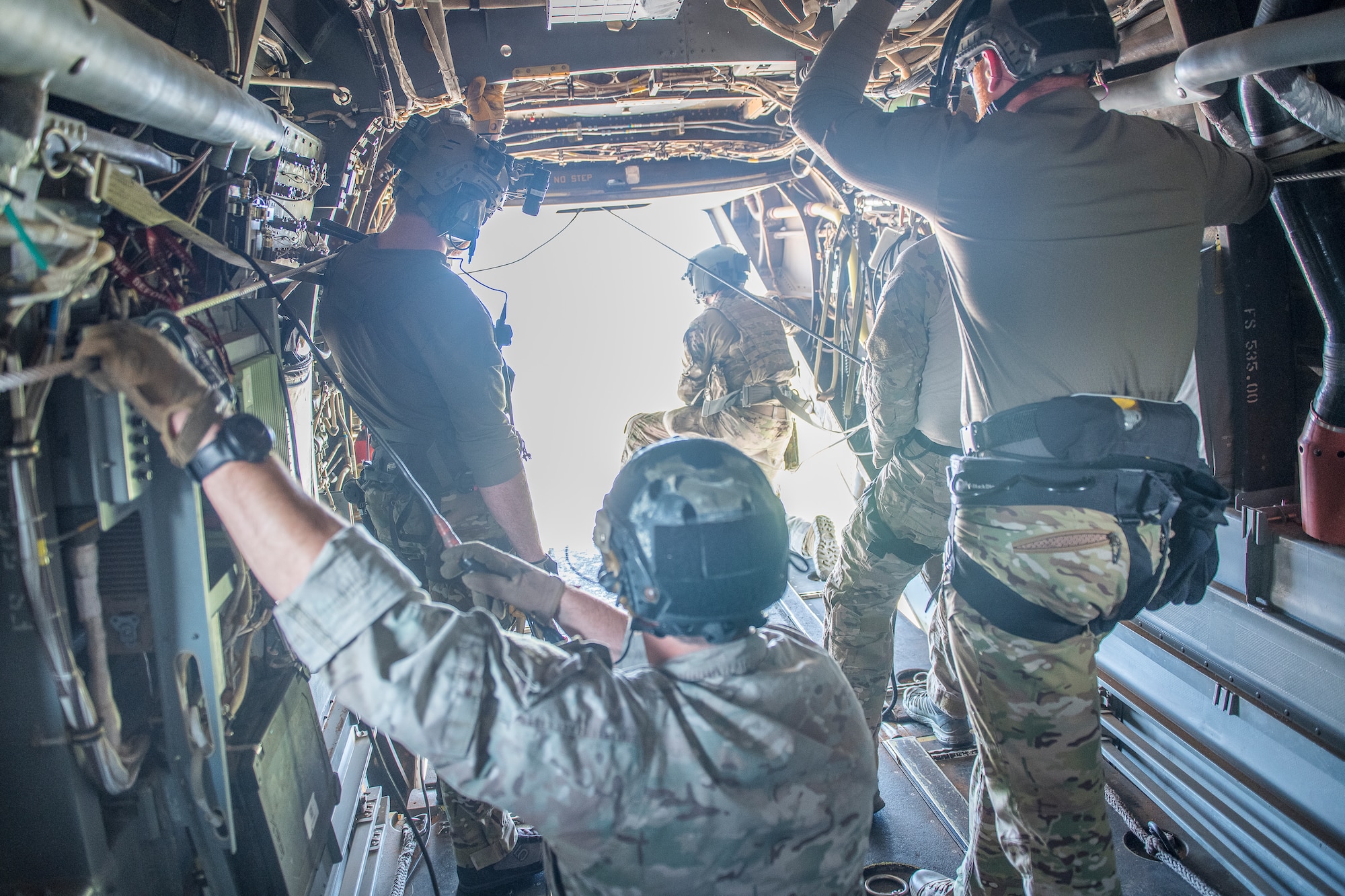 Pararescuemen from the 26th Special Tactics Squadron fly in a CV-22 Osprey to over New Mexico July 23, 2019. The members practiced water-based aerial extraction at Ute Lake with members of the 20th Special Operations Squadron. (U.S. Air Force photo by Senior Airman Vernon R. Walter III)