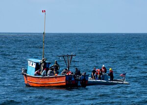 Two boats next to each other on the water.