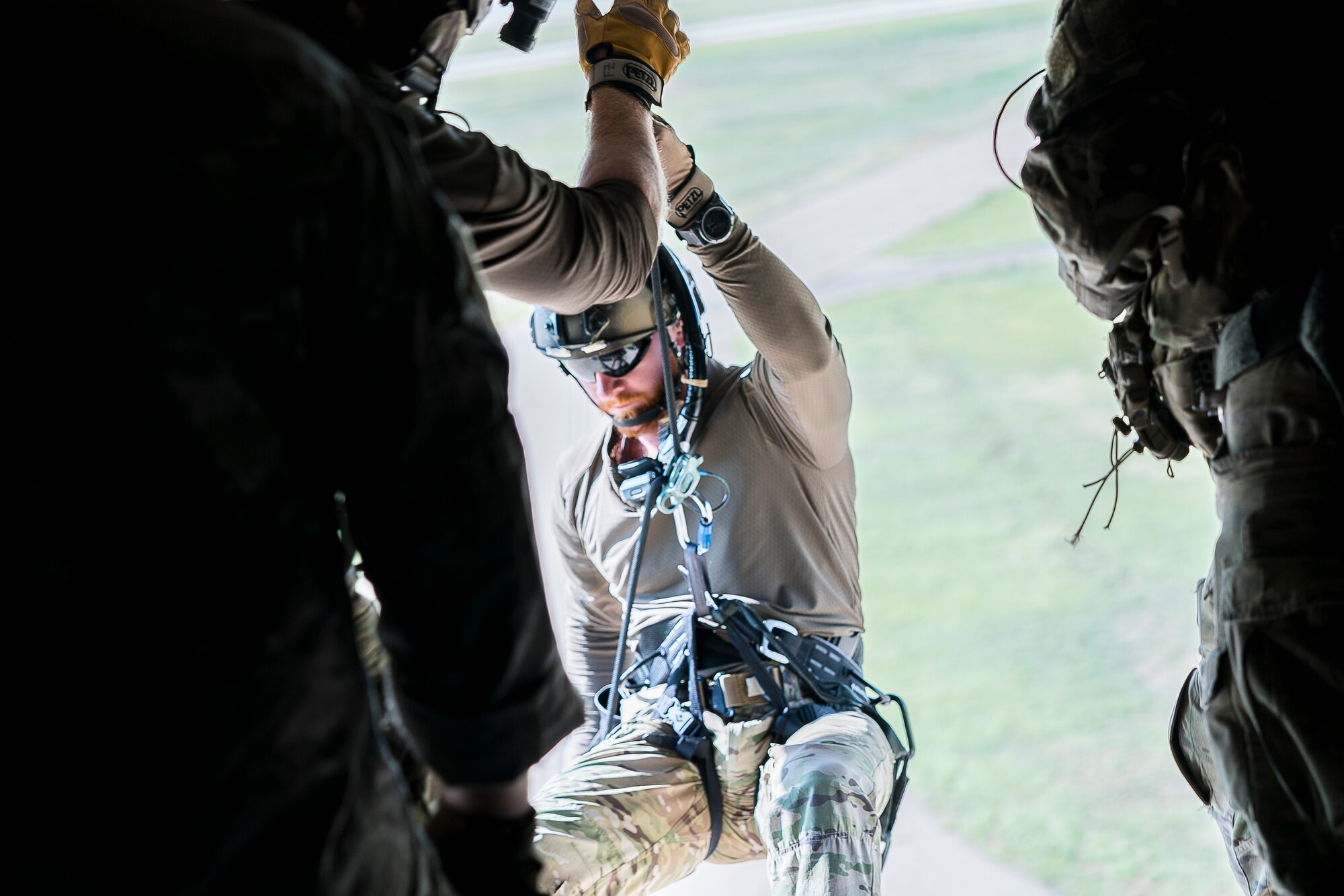 Staff Sgt. Joe, 26th Special Tactics Squadron pararescuman, rappels from a CV-22 Osprey with the 20th Special Operations Squadron at Cannon Air Force Base, N.M., July 23, 2019. The training tested the air-to-land capabilities of the pararescuemen. (U.S. Air Force photo by Senior Airman Vernon R. Walter III)