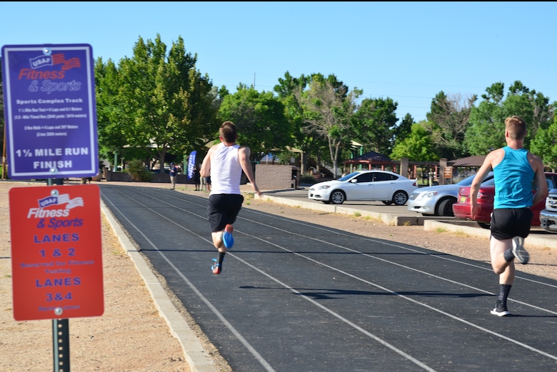 Participants in the Fastest Athletes on Base Track Meet sprint to the finish line.
