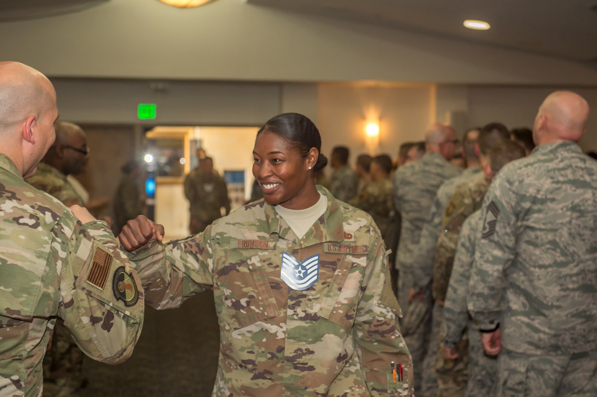 Technical Sgt. Alexis Brunson is congratulated¬ by a fellow Airman during a technical sergeant release party at Edwards Air Force Base, July 18. (U.S. Air Force photo by Richard Gonzales)