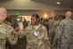 Technical Sgt. Alexis Brunson is congratulated¬ by a fellow Airman during a technical sergeant release party at Edwards Air Force Base, July 18. (U.S. Air Force photo by Richard Gonzales)