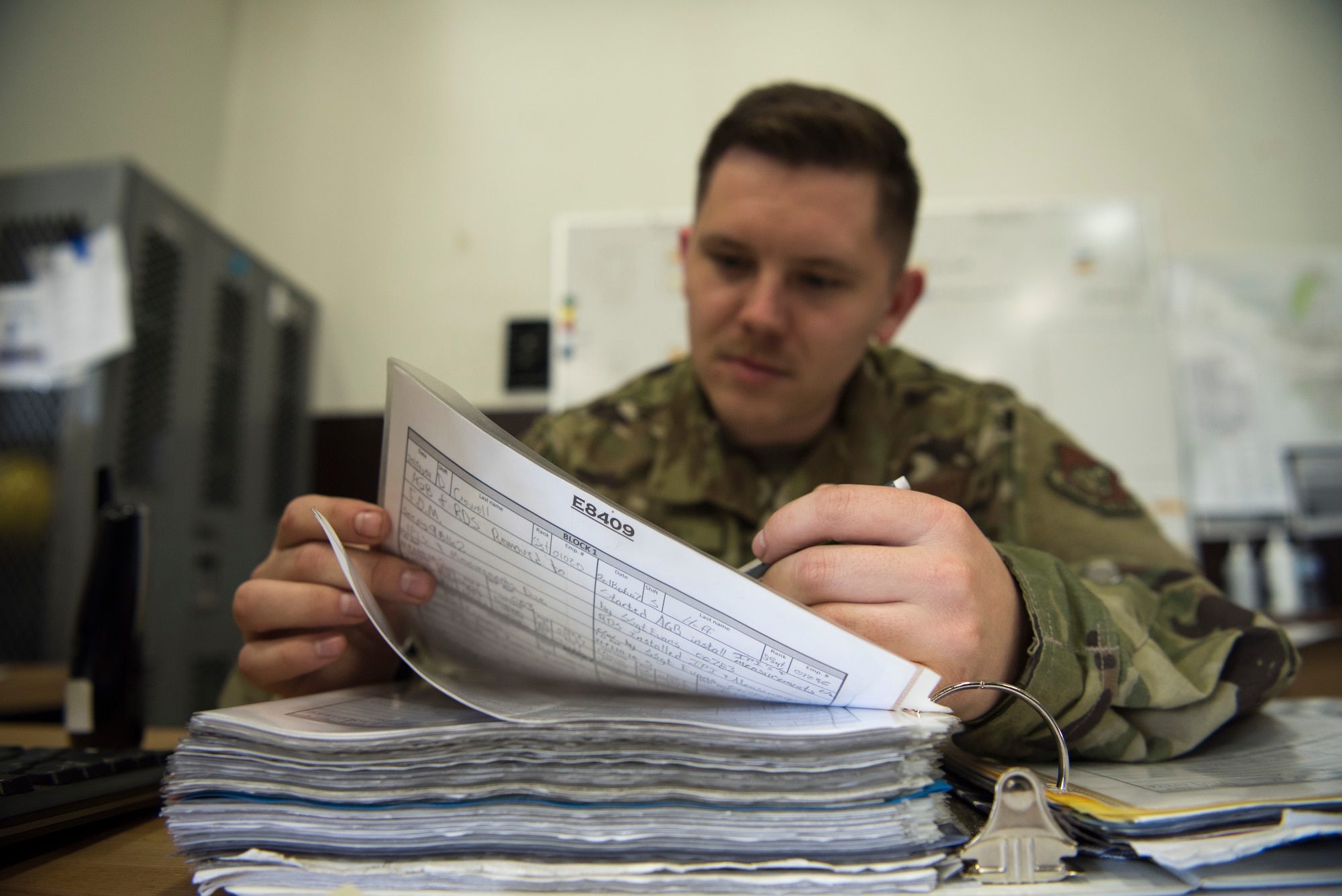 U.S. Air Force Tech. Sgt. James Huff, a 35th Maintenance Squadron aerospace propulsion craftsman, fills out paperwork at Misawa Air Base, Japan, July 16, 2019. The 35th MXS propulsions centralized repair facility broke the record of engines serviced in a month since 2006. (U.S. Air Force photo by Senior Airman Collette Brooks)