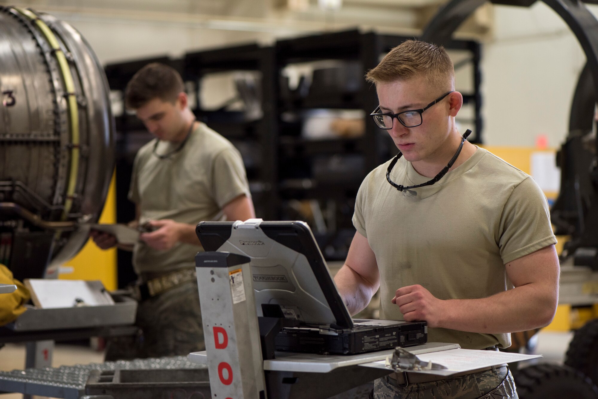 U.S. Air Force Airman Ryan Voss, a 35th Maintenance Squadron aerospace propulsion journeyman, works on a computer at Misawa Air Base, Japan, July 16, 2019. A newly opened storage facility, dedication and work ethic allowed the 35th MXS propulsions centralized repair team to produce a record breaking amount of serviced engines in a month since 2006. (U.S. Air Force photo by Senior Airman Collette Brooks)