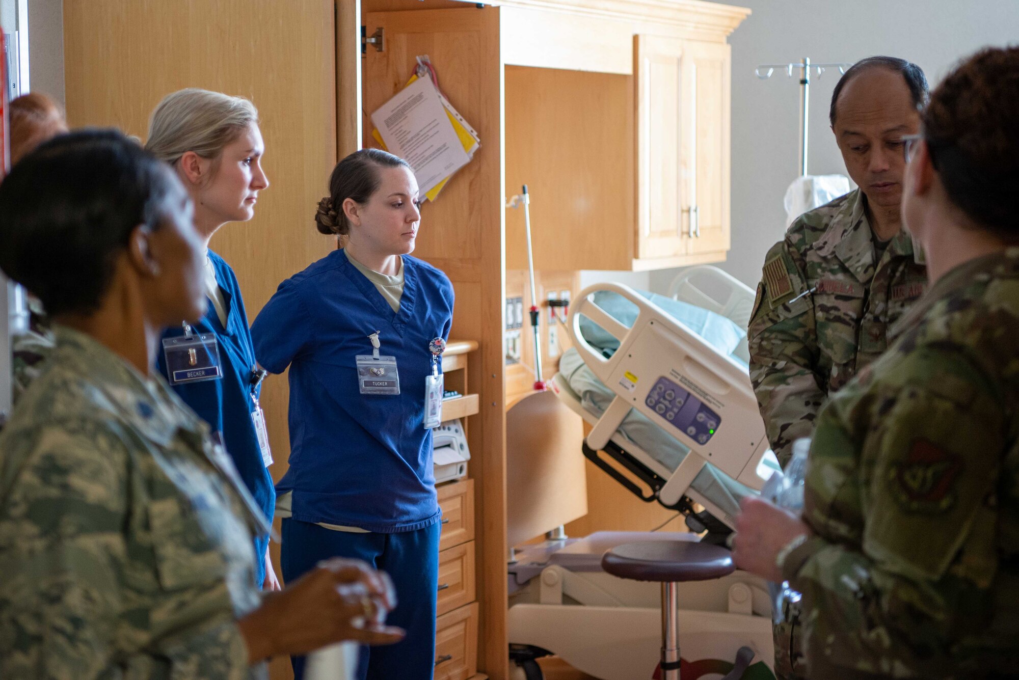 Col. Rudolph Cachuela, Pacific Air Forces Command Surgeon, receives a tour of the Multi Service Inpatient Unit  from members of the 374th Medical Group at Yokota AB, Japan, July 23, 2019. Cachuela visited the 374th Medical Group to better understand how his team can increase the effectiveness of the medical personnel at Yokota.