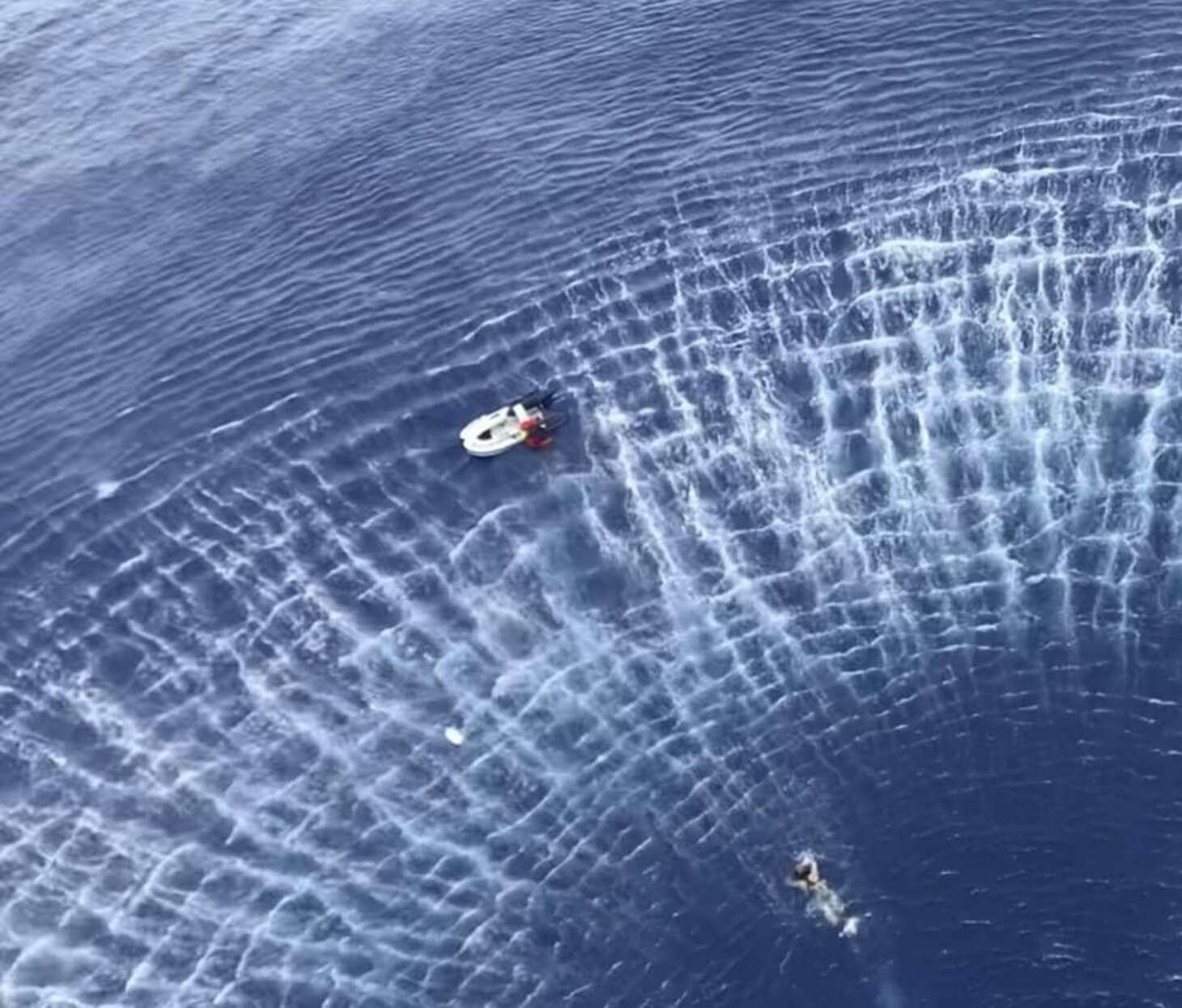 PACIFIC OCEAN (July 24, 2019) Naval Air Crewman (Helicopter) 2nd Class Preston Smith, from Stevens Point, Wisconsin, and assigned to the “Island Knights” of Helicopter Sea Combat Squadron (HSC) 25, swims toward a civilian in distress aboard a sailboat during a search and rescue mission near Guam. HSC-25 provides a multi-mission rotary wing capability for units in the U.S. 7th Fleet area of operations and maintains a Guam-based 24-hour search-and-rescue and medical evacuation capability, directly supporting U.S. Coast Guard and Joint Region Marianas. HSC-25 is the Navy’s only forward-deployed MH-60S expeditionary squadron.