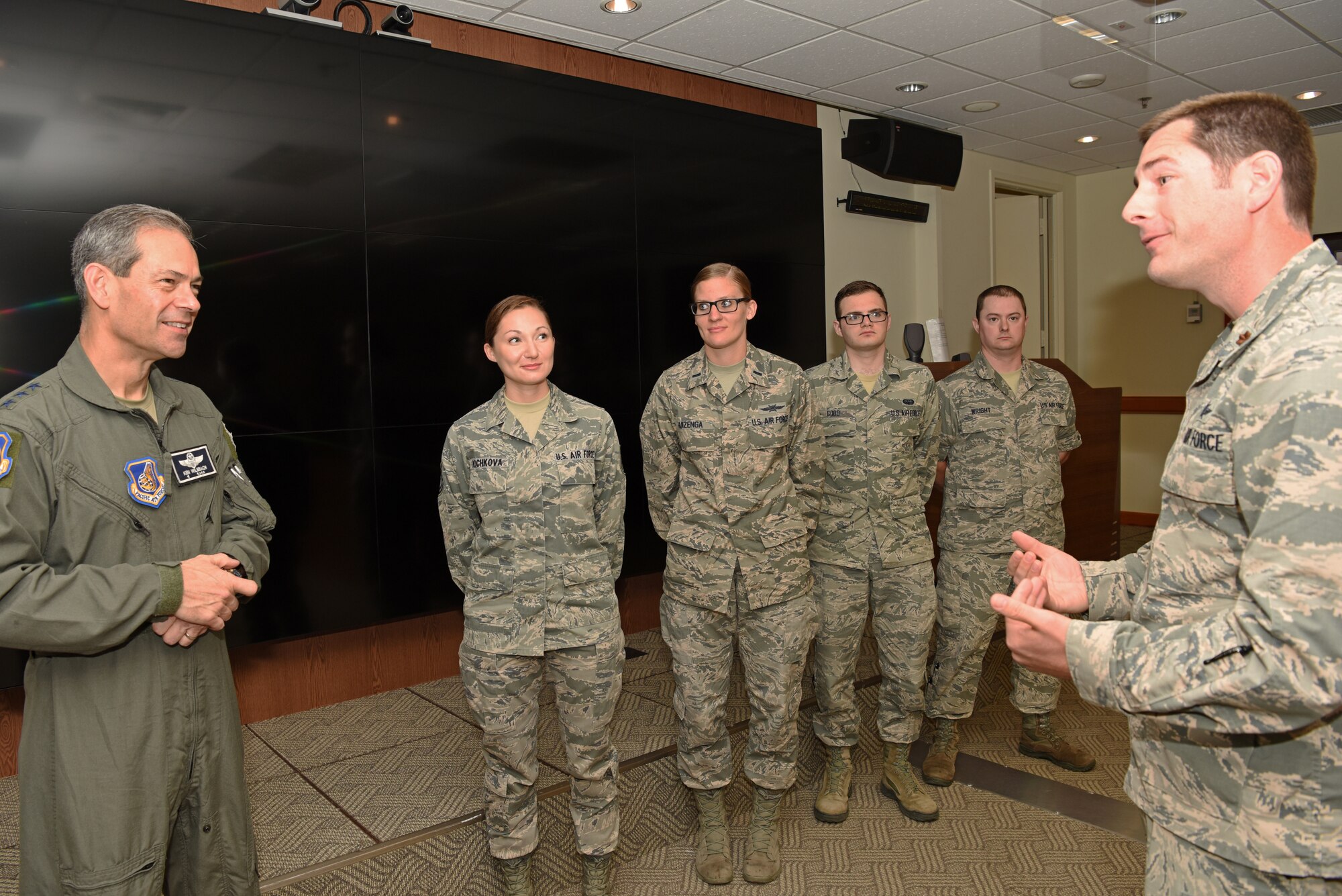 U.S. Air Force Lt. Gen. Kenneth S. Wilsbach, 7th Air Force commander, speaks with Maj. Dustin Burleson, 8th Communications Squadron commander, about the communication security team at Kunsan Air Base, Republic of Korea, July 19, 2019. Wilsbach visited Kunsan to recognize several Airman and hold a town hall meeting for officers. (U.S. Air Force photo by Staff Sgt. Joshua Edwards)