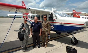 Lt. Col. Ken Curell (center) of CAP’s Ohio Wing is flanked by two Pilot Prep Program students – Air Force 1st Lts. Sherry Meadows, assigned to Aviano Air Base, Italy, and Makenna Elliott, assigned to Offutt Air Force Base, Neb. (Civil Air Patrol photo by Ron Olienyk)