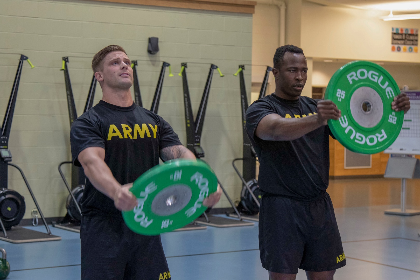 U.S. Army Staff Sgt. Andrew Estabrook, left, 2nd Brigade, 377th Parachute Field Artillery Regiment, and Alaska Army National Guard 2nd Lt. Innocent Bennett, 297th Infantry Battalion, practice physical fitness training at Buckner Fitness Center on Joint Base Elmendorf-Richardson as part of the Master Fitness Trainer Course July 24, 2019. The MFTC trains selected Soldiers in all aspects of the Army's Physical Readiness Training system. Once qualified, the trainers advise Soldiers on physical readiness issues and monitor unit and individual physical readiness programs.